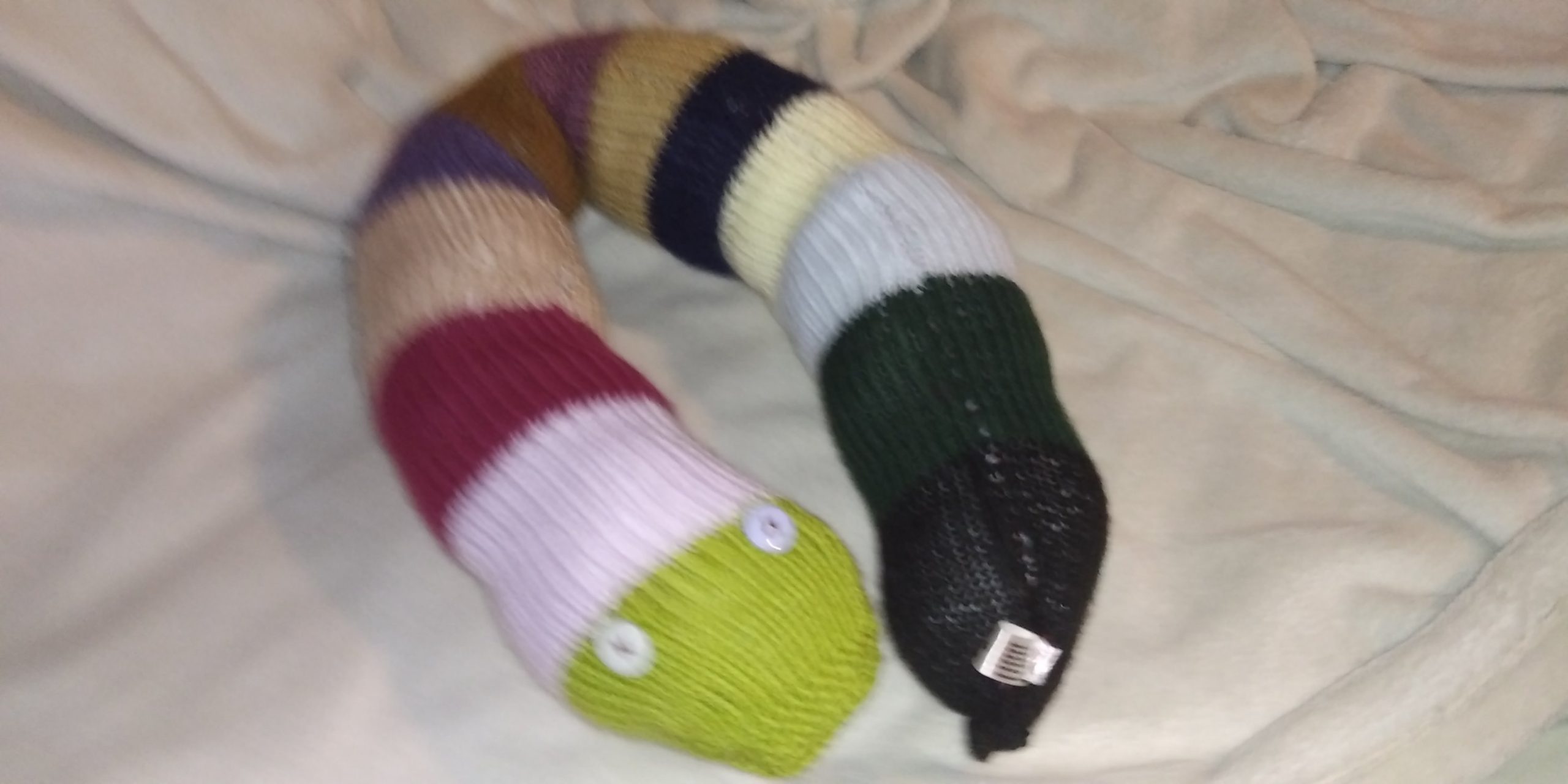 Slither the Pea Green and Earthy tones Banded Giant Snake.