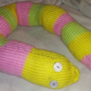 Tang the Yellow Pink and Green Banded Giant Snake.