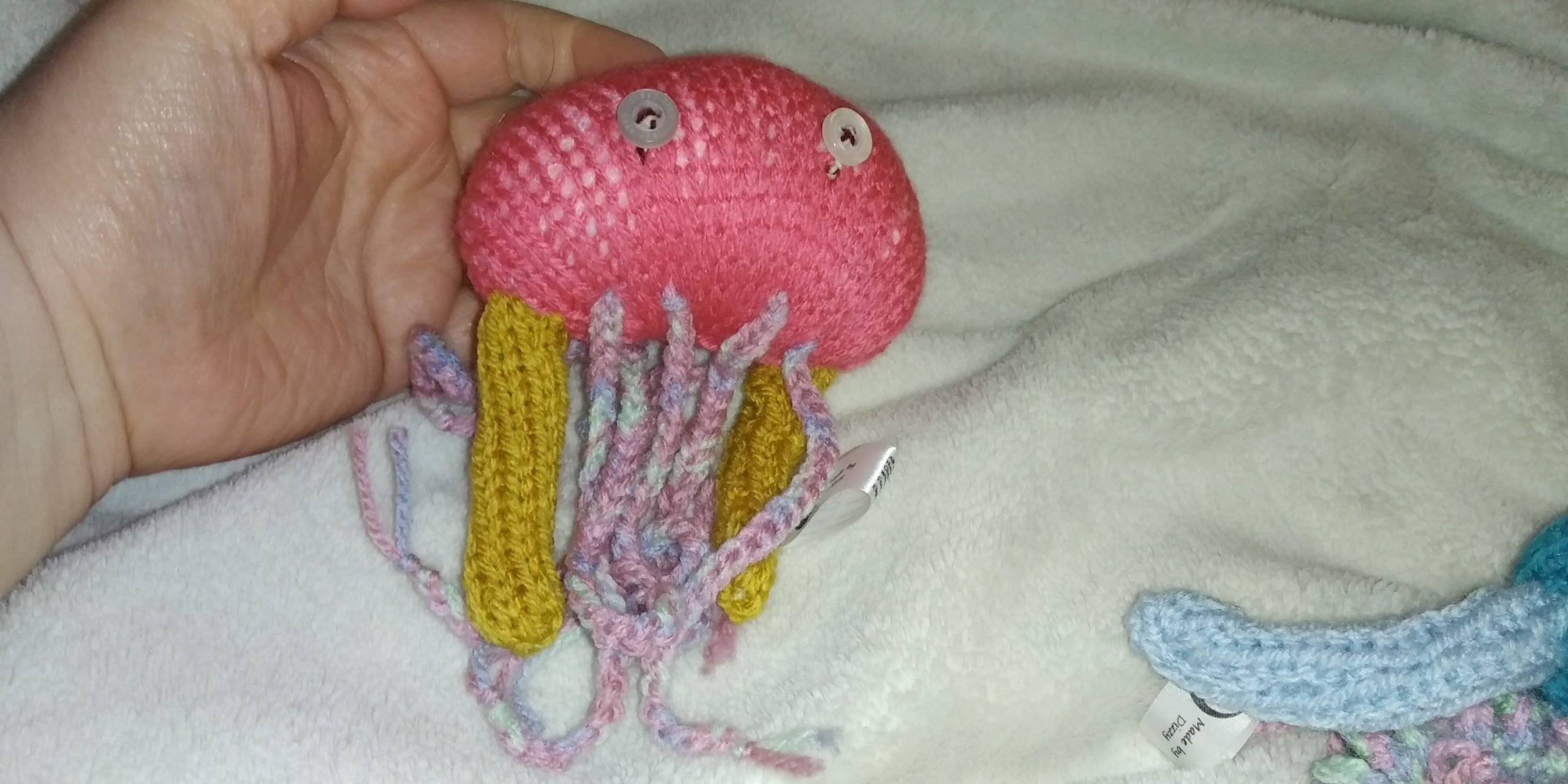 Beeti the Coral Red with Rainbow Feelers Jellyfish
